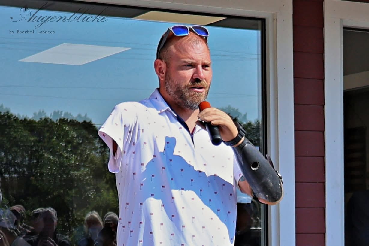 Travis Mills addresses the crowd at the start of the 2025 ride.