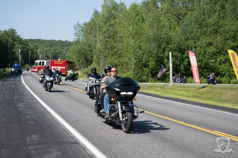 The road captain leads the way, guiding the 2026 procession along the 61-mile route.